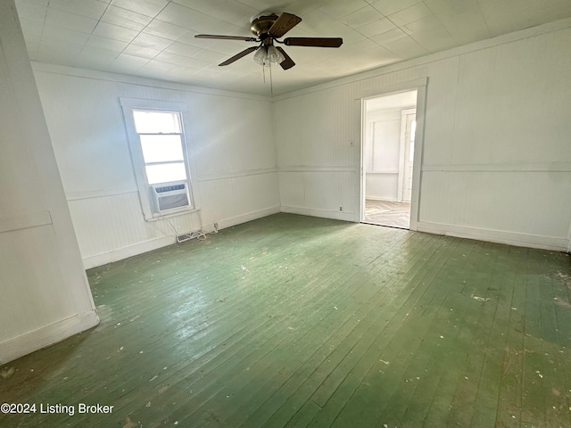 spare room with ceiling fan and dark hardwood / wood-style floors