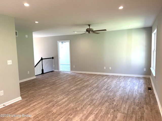 empty room featuring hardwood / wood-style flooring and ceiling fan