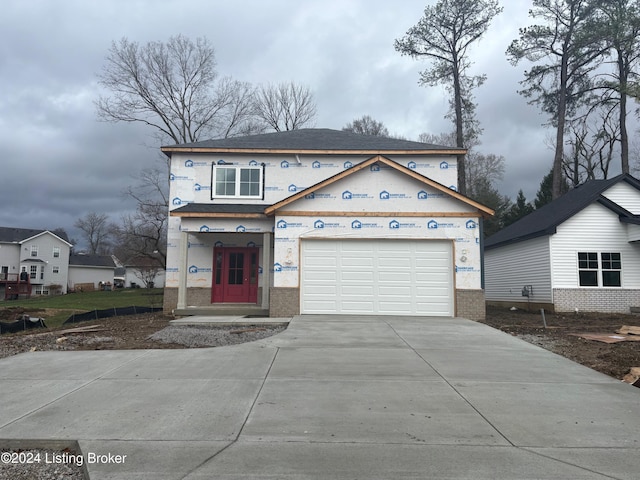 unfinished property featuring a garage