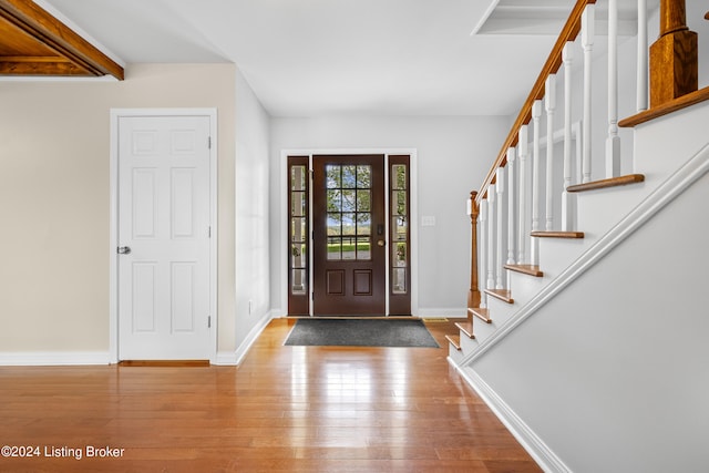 entryway with hardwood / wood-style floors