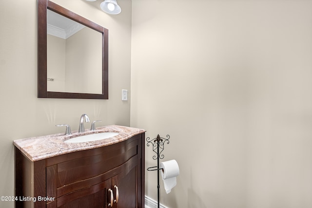 bathroom with oversized vanity and ornamental molding