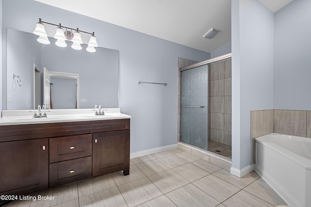 bathroom with tile flooring, shower with separate bathtub, and dual vanity