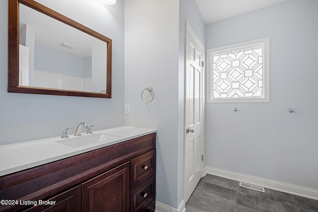 bathroom featuring vanity and tile flooring