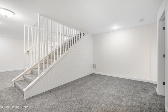 stairs with dark colored carpet