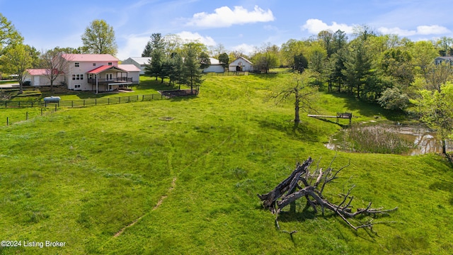 view of yard with a rural view