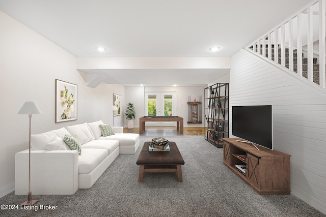 carpeted living room featuring beam ceiling and french doors