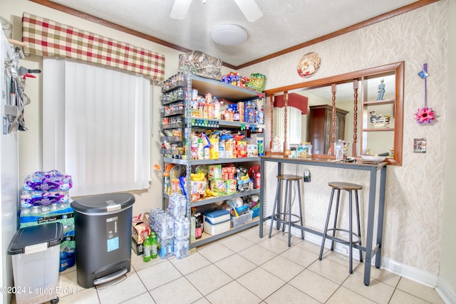 kitchen featuring wallpapered walls, baseboards, a textured ceiling, tile patterned floors, and ceiling fan