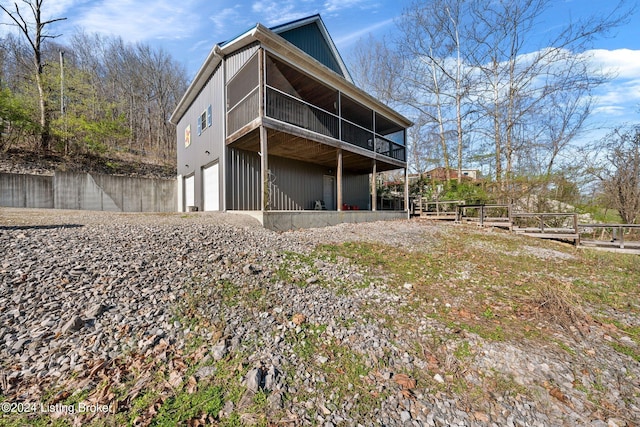 1478 Robbin Ln, Cub Run, KY 42729 - rear view of property featuring an attached garage and a sunroom