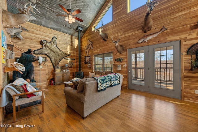 1478 Robbin Ln, Cub Run, KY 42729 - living area with a ceiling fan, wood finished floors, a wood stove, and wooden walls