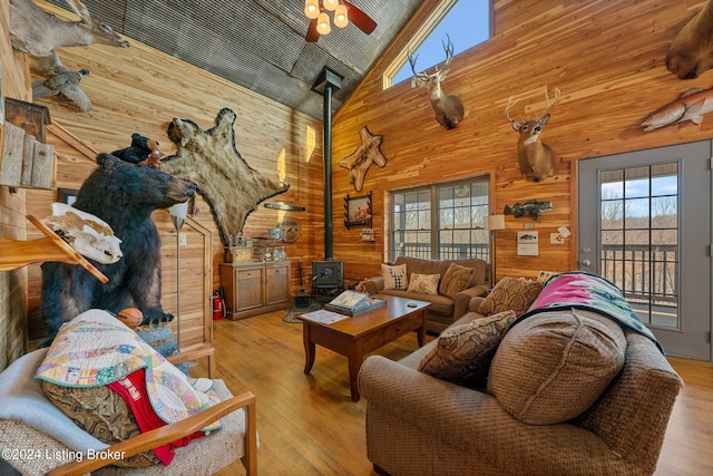 1478 Robbin Ln, Cub Run, KY 42729 - living area featuring plenty of natural light, wood finished floors, wood walls, and a wood stove