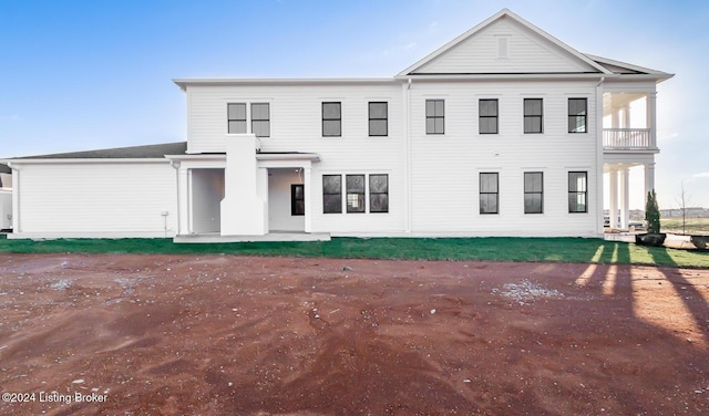 view of front of home with a balcony