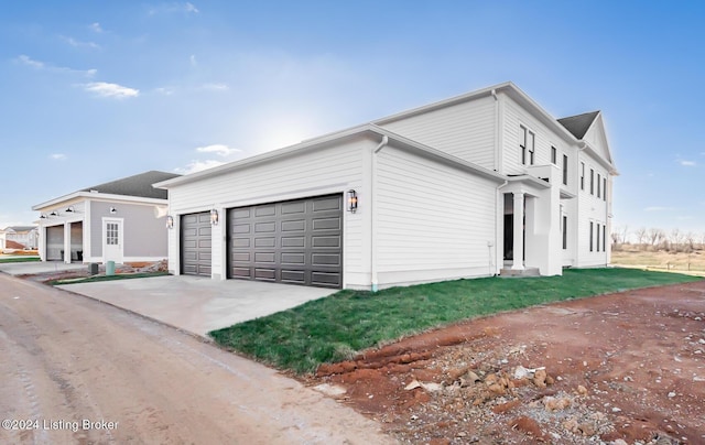 view of side of home with a garage