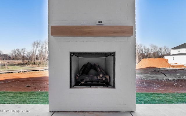 details featuring an outdoor fireplace