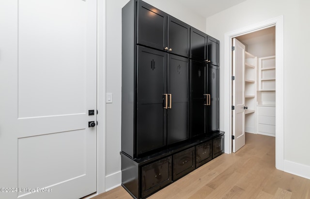 mudroom with light hardwood / wood-style floors