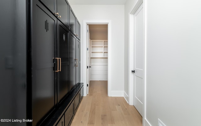 hall with light hardwood / wood-style floors