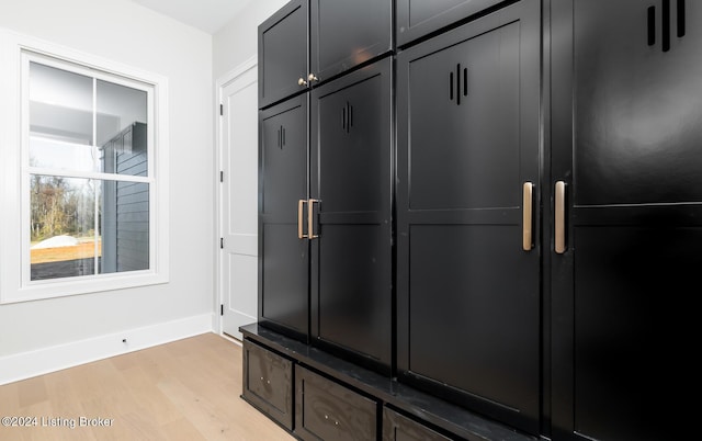 mudroom with light hardwood / wood-style floors