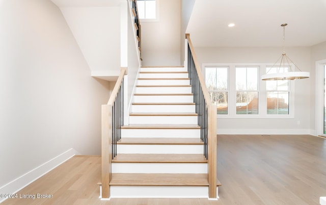 stairs with wood-type flooring