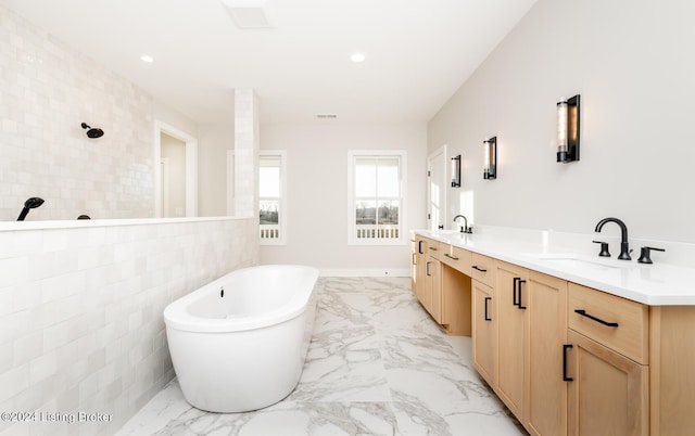 bathroom featuring vanity, shower with separate bathtub, and tile walls