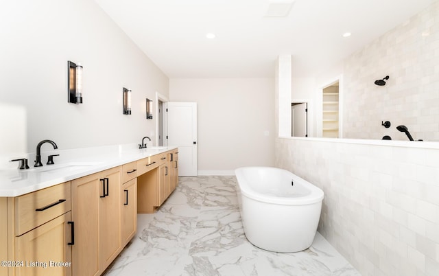 bathroom with vanity, tile walls, and independent shower and bath