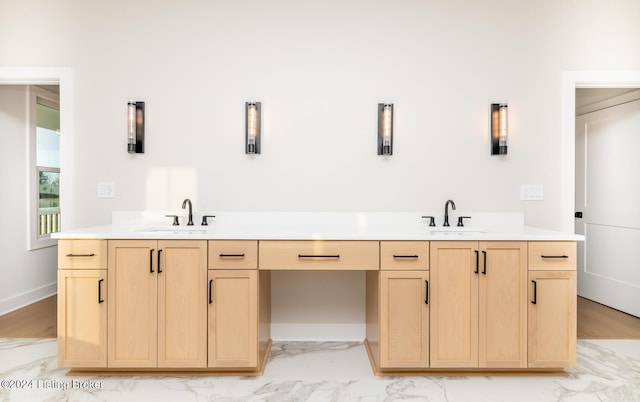 bathroom with vanity and hardwood / wood-style flooring