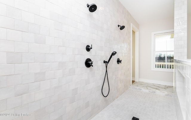 bathroom with a tile shower