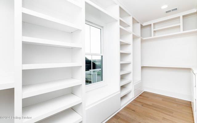 spacious closet featuring hardwood / wood-style floors