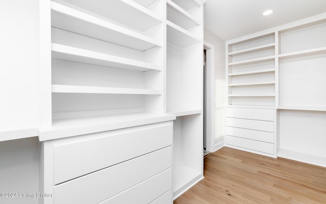 walk in closet featuring light hardwood / wood-style floors