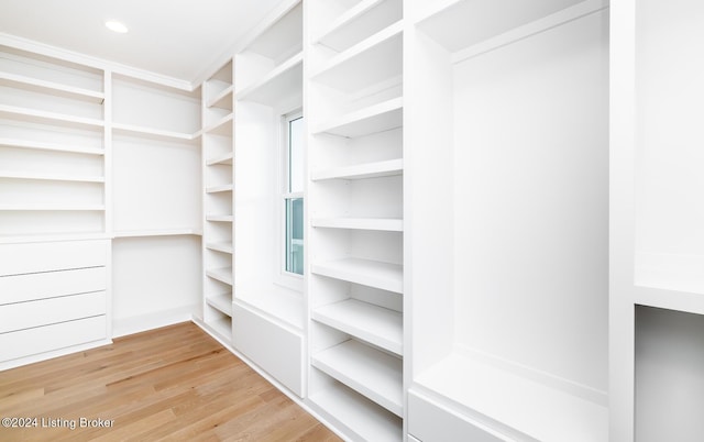 walk in closet featuring hardwood / wood-style flooring