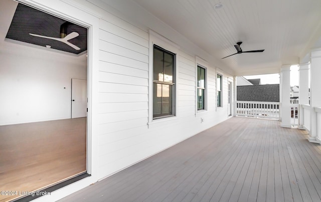 wooden terrace featuring ceiling fan and covered porch