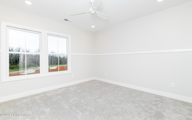 spare room featuring carpet flooring and ceiling fan