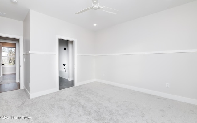 carpeted empty room with ceiling fan