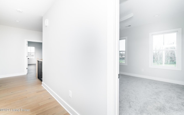 corridor featuring light hardwood / wood-style floors