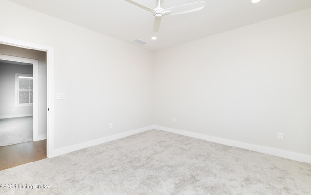 spare room with carpet flooring and ceiling fan