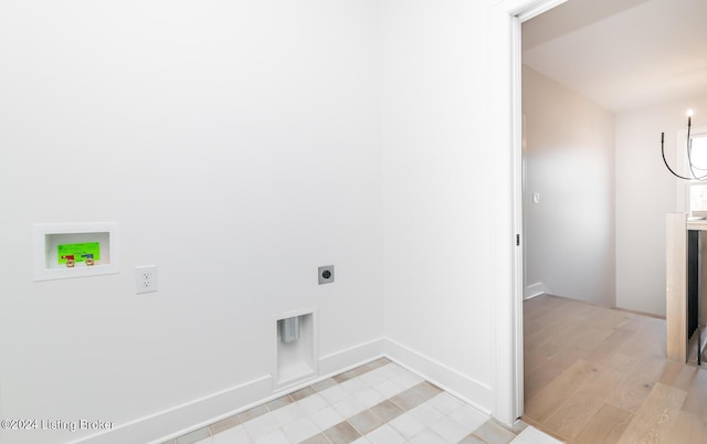 washroom with washer hookup, a notable chandelier, hookup for an electric dryer, and light wood-type flooring