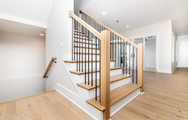 stairway featuring hardwood / wood-style flooring