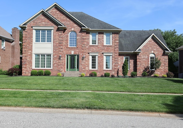 9602 Moorfield Cir, Louisville, KY 40241 - view of front of home with brick siding, a front lawn, and roof with shingles