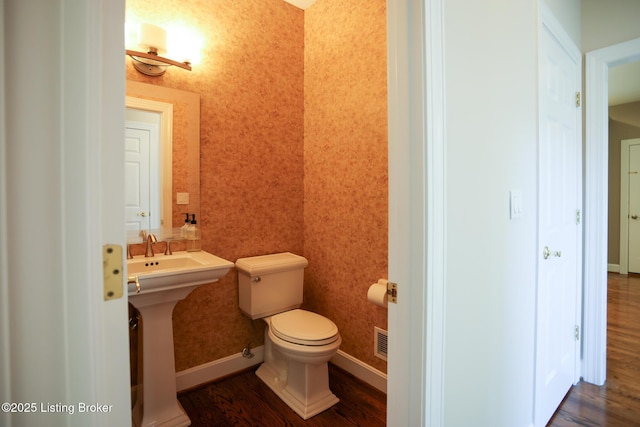 9602 Moorfield Cir, Louisville, KY 40241 - bathroom featuring wood finished floors, toilet, and baseboards