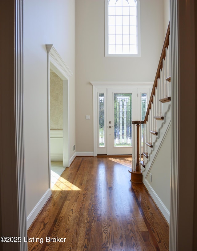 9602 Moorfield Cir, Louisville, KY 40241 - entryway featuring a high ceiling, stairway, wood finished floors, and baseboards
