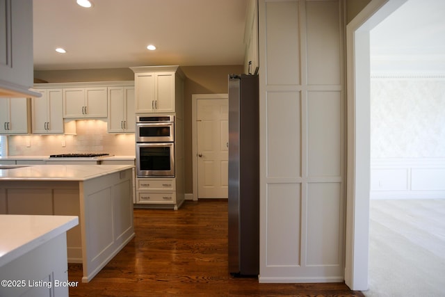 9602 Moorfield Cir, Louisville, KY 40241 - kitchen featuring appliances with stainless steel finishes, light countertops, decorative backsplash, white cabinetry, and recessed lighting