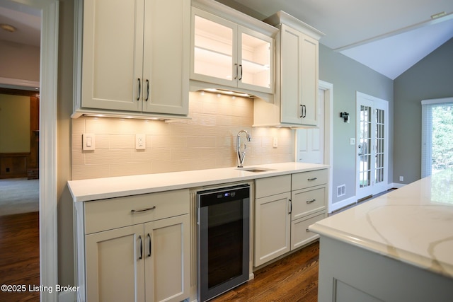 9602 Moorfield Cir, Louisville, KY 40241 - kitchen with wine cooler, a sink, dark wood-style floors, backsplash, and lofted ceiling