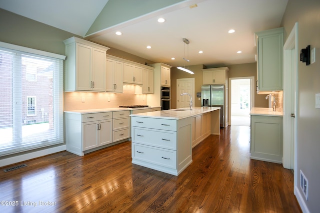9602 Moorfield Cir, Louisville, KY 40241 - kitchen featuring stainless steel appliances, a sink, light countertops, backsplash, and dark wood-style floors