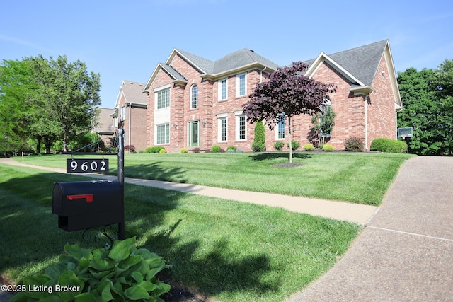 9602 Moorfield Cir, Louisville, KY 40241 - colonial-style house featuring brick siding and a front lawn