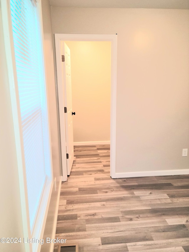 hallway featuring light hardwood / wood-style flooring