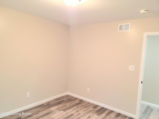 empty room featuring wood-type flooring