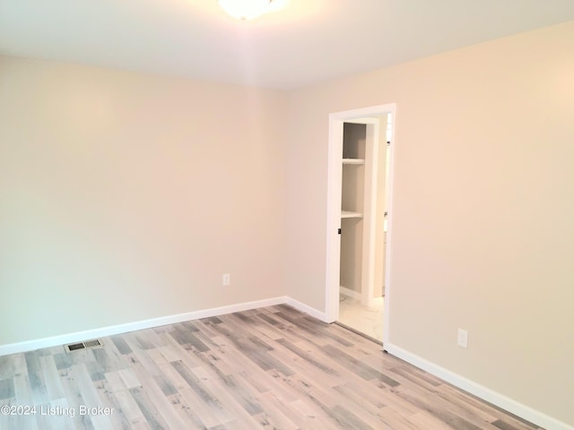 unfurnished room featuring light hardwood / wood-style floors