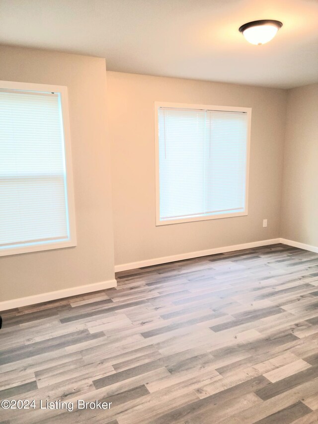 empty room featuring wood-type flooring