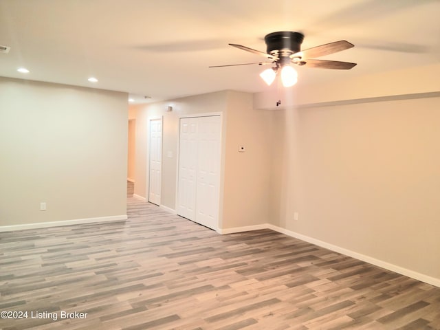 unfurnished room with wood-type flooring and ceiling fan