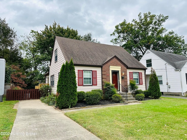 view of front of home with a front lawn