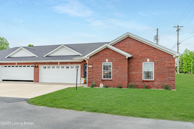 view of front of property featuring a garage and a front lawn