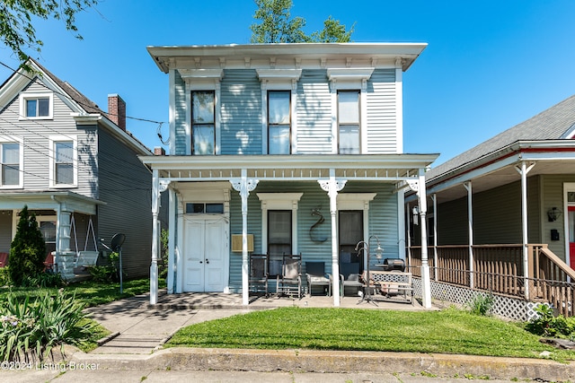 italianate home featuring covered porch